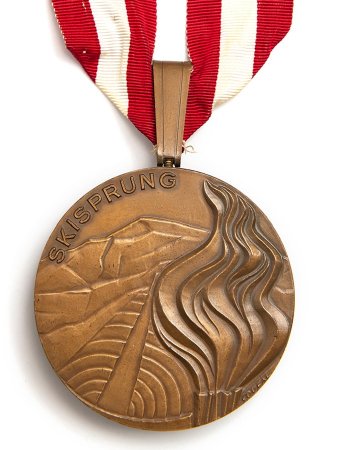 Front: Innsbruck 1976 gold medal, Olympic flame & ski jump, ski Jumping