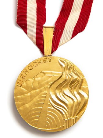 Front: Innsbruck 1976 gold medal, Olympic flame & ski jump, ice hockey