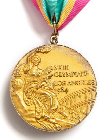 Front: Los Angeles 1984 gold medal, Victory and Colosseum in background