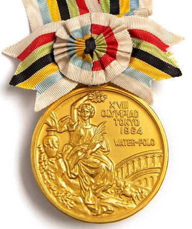 Front: Tokyo 1964 gold medal, seated Nike, goddess of Victory, water polo