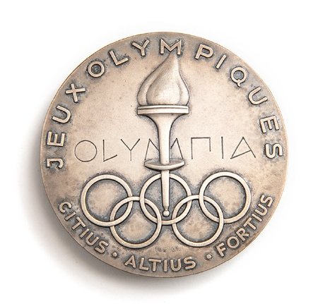 Front: Oslo 1952 silver medal, raised torch set in Olympic Rings & legend