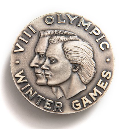 Front: Squaw Valley 1960 silver medal, male & female head with legend