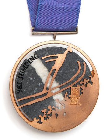 Back: Lillehammer bronze medal, ski jumping pictogram and Games emblem