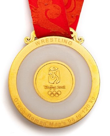 Back: Beijing gold medal, Games emblem surround by jade, wrestling