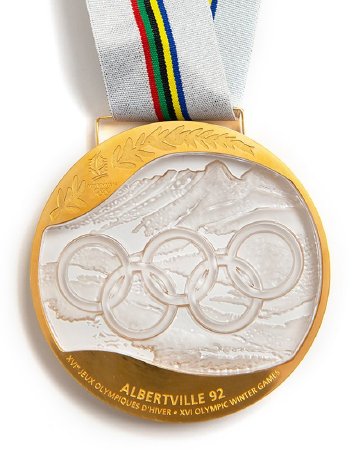 Front: Albertville 1992 gold medal, Olympic rings over alpine landscape