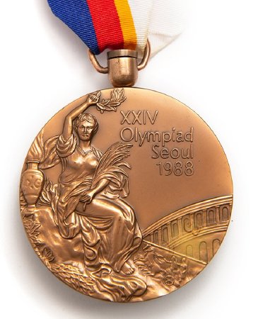 Front: Seoul 1988 bronze medal, Victory and Colosseum in background
