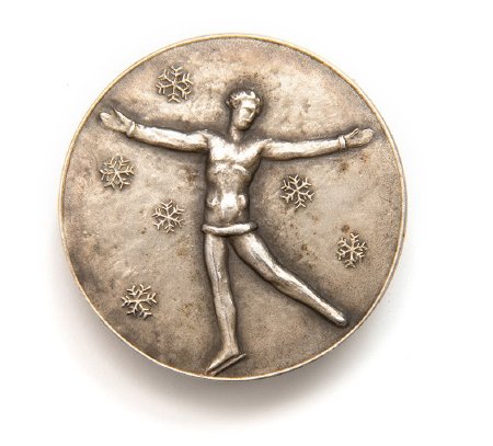 Front: St. Moritz 1928 silver medal, Female skater with ice crystals
