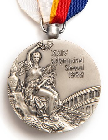Front: Seoul 1988 silver medal, Victory and Colosseum in background
