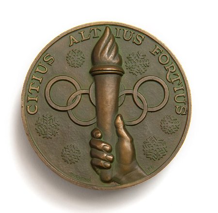 Back: St. Moritz 1948 prize medals, hand holding torch over Olympic rings