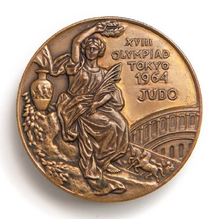 Front: Tokyo 1964 bronze medal, seated Nike, goddess of Victory, judo