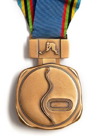 Front: Sapporo 1972 bronze medal, ski trail and speed skating stadium